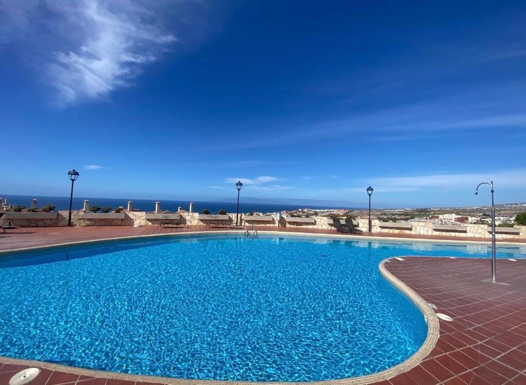 Pool and coastal outlook at the Golden View apartment complex in Costa Adeje