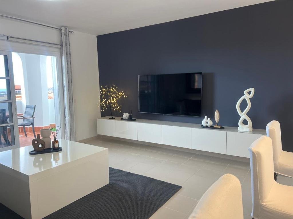 Living room seating and television — Golden View Costa Adeje photo gallery